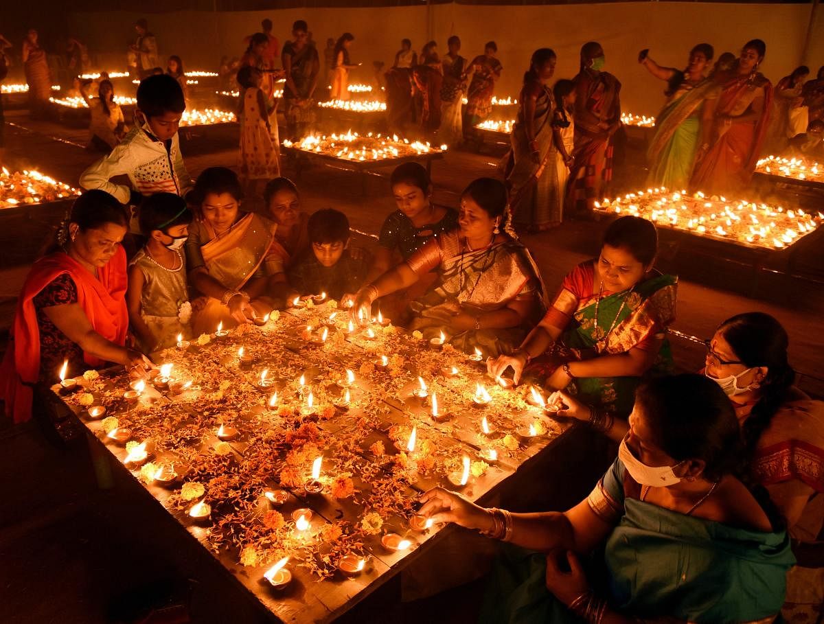 Devotees light earthen lamps during 'Karthika Masam' in Hyderabad. Credit: PTI Photo