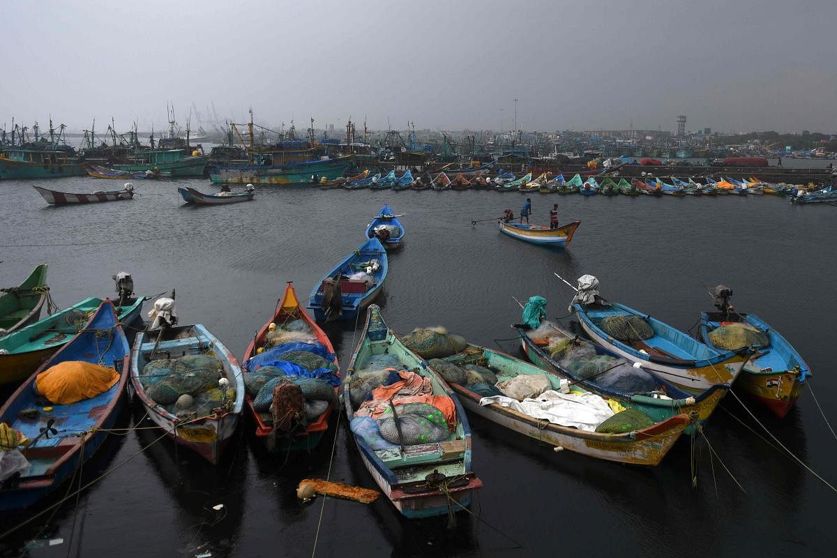 Fishermen anchor their boat as cyclone Nivar approaches the eastern Indian coast, at Kasimedu fishing harbour in Chennai. Credit: AFP Photo