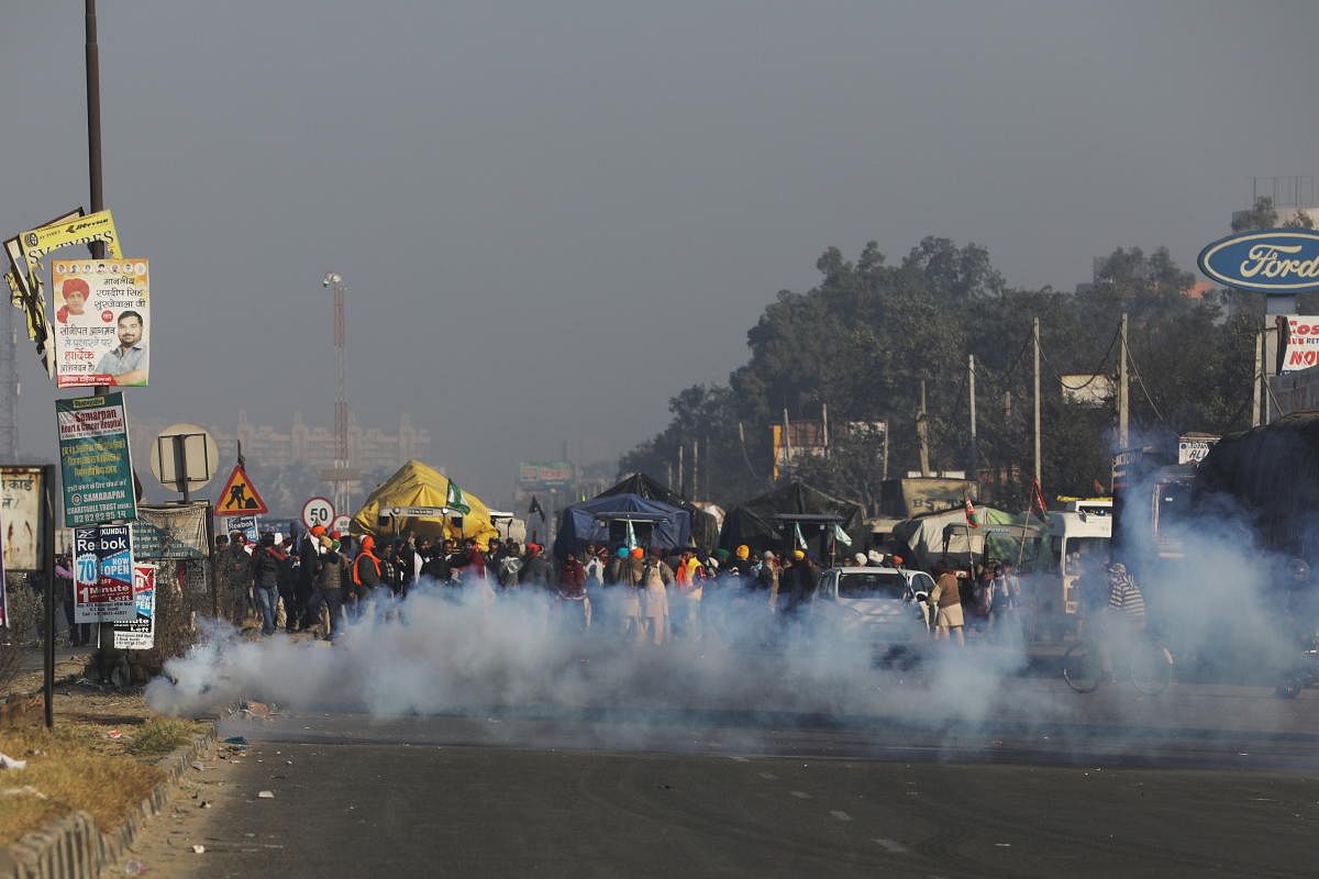 Tear gas is released to stop farmers opposing the newly passed farm bills from entering the national capital Delhi, at Singhu border, India, November 27, 2020. Credit: Reuters Photo