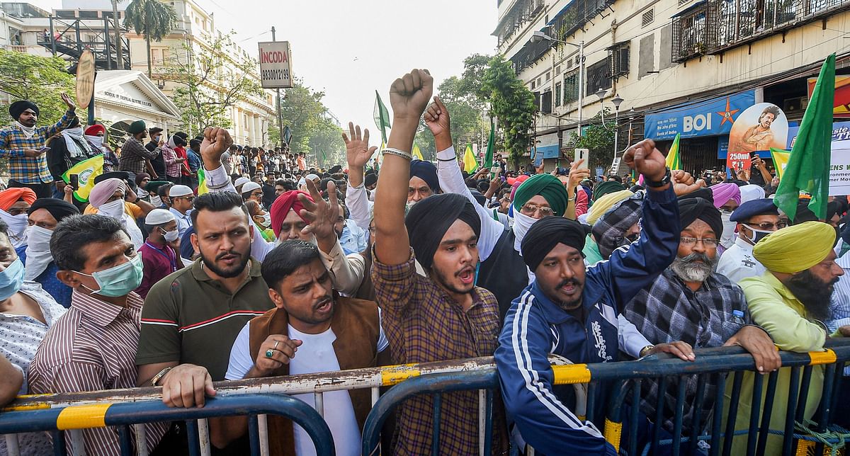 People belonging to Sikh community participate in a rally in solidarity with farmers