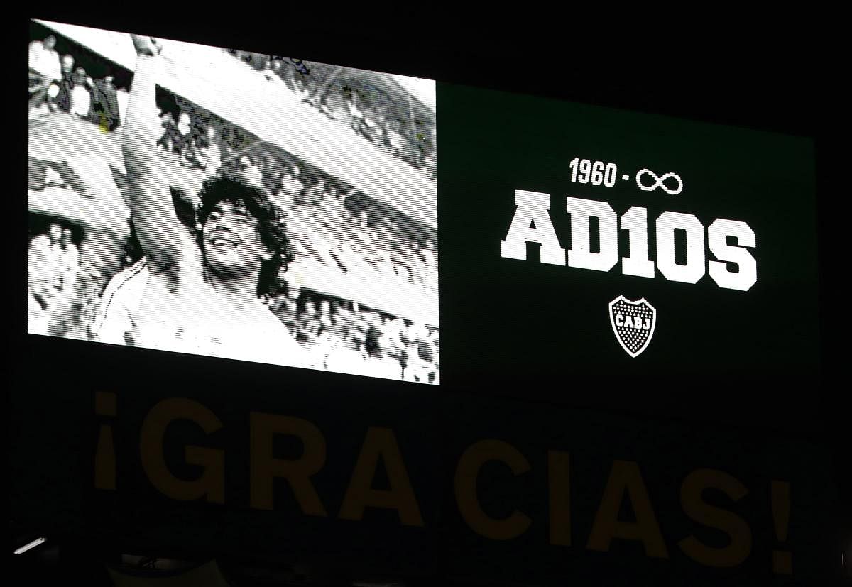 The stadium's screen shows a photo of Diego Maradona reading '1960-infinity. Goodbye' at La Bombonera stadium to pay homage to late Argentinian football legend Diego Maradona during the Copa Diego Maradona 2020 football match between Boca Juniors and Newell's Old Boys, in Buenos Aires. The Argentine football championship has been renamed after the death of football legend Diego Maradona. Credit: AFP Photo