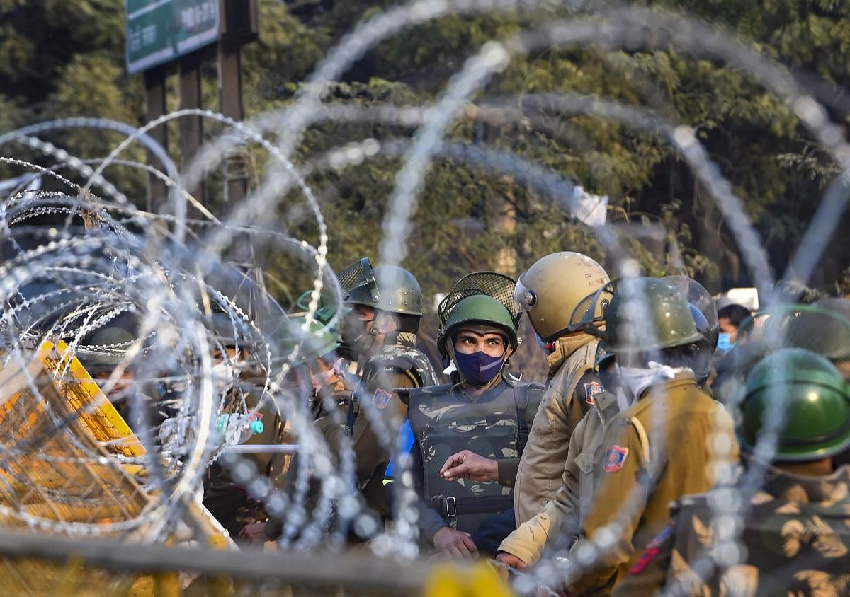 Tight security arrangements at the Singhu border during farmers' ongoing 'Delhi Chalo' protest against Centre's new farm laws, in New Delhi. Credit: PTI Photo