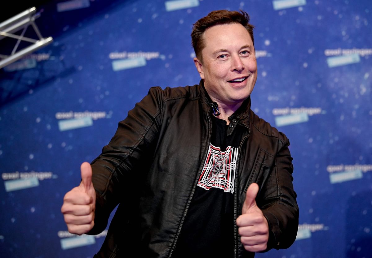 SpaceX owner and Tesla CEO Elon Musk poses as he arrives on the red carpet for the Axel Springer Awards ceremony, in Berlin. Credit: AFP Photo