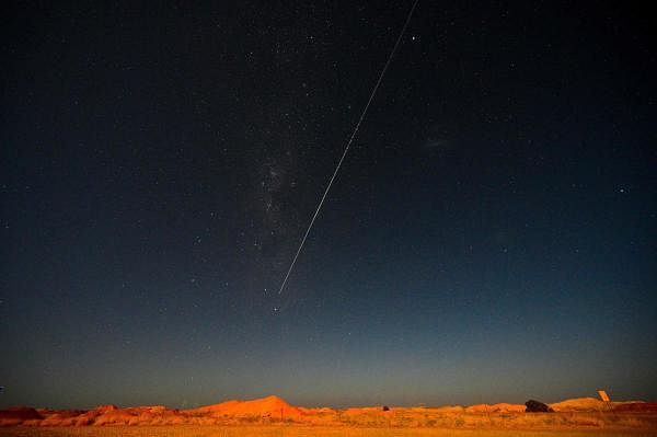 JAXA's Hayabusa-2 probe's sample drops to earth after landing on and gathering material from an asteroid some 300 million kilometres from Earth, is seen from Coober Pedy in South Australia. Credit: AFP