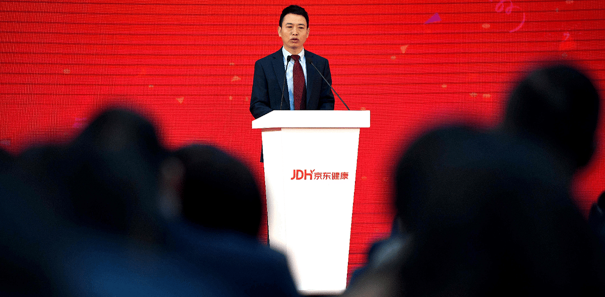 JD Health International CEO Xin Lijun delivers a speech during the company’s initial public offering (IPO) ceremony at the JD headquarters in Beijing. Credit: AFP