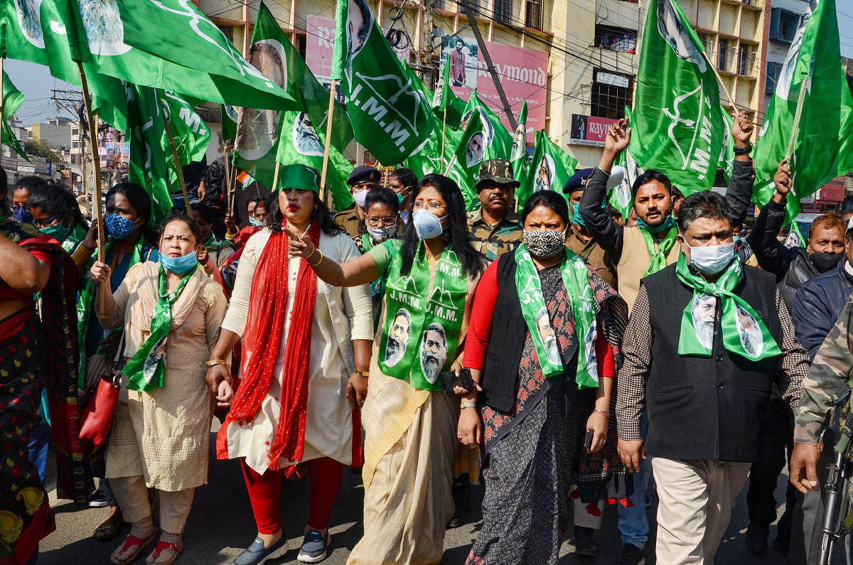Jharkhand Mukti Morcha (JMM) activists participate in a rally in support of the nationwide strike, called by agitating farmers to press for repeal of the Centre's farm laws, in Ranchi. Credit: PTI Photo.
