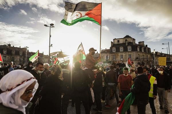 Protestors hold Western Sahara flags during a demonstration, in Bordeaux, southwestern France. Credit: AFP