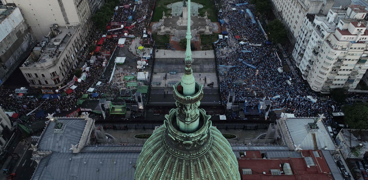 Aerial view showing anti-abortion activists (R) and abortion rights supporters (L) gathering outside the Argentine Congress as senators debate a landmark bill on whether to legalize abortion in Buenos Aires. Credit: AFP