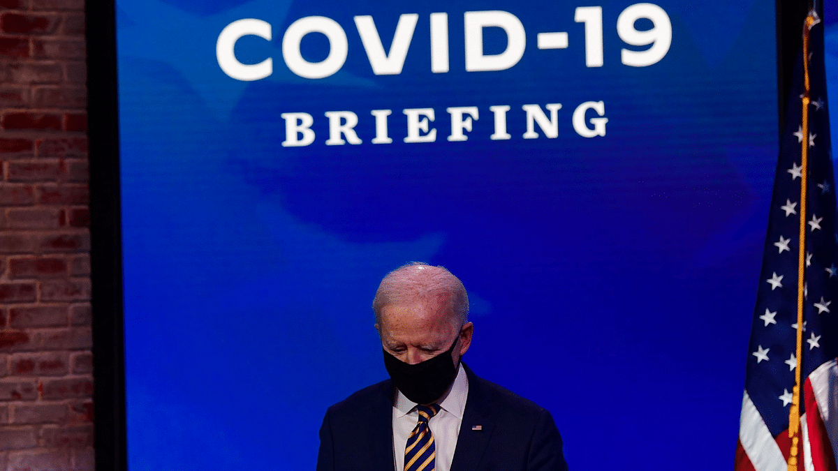 US President-elect Joe Biden arrives on stage to deliver remarks on the ongoing coronavirus pandemic at the Queen Theater on December 29, 2020 in Wilmington, Delaware. Credit: AFP AFP