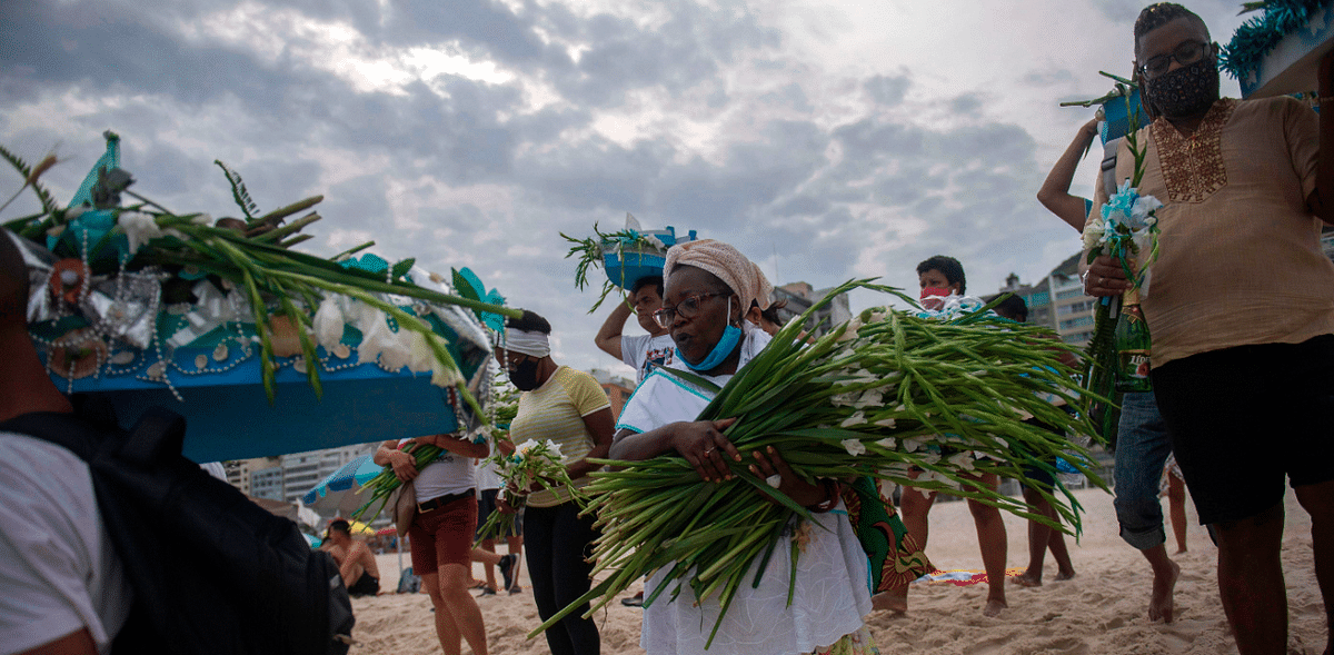 Worshippers make an end-of-year offering to Iemanja, the Goddess of the Sea of the Afro-Brazilian religion Umbanda, at Copacabana Beach in Rio de Janeiro, Brazil. Credit: Reuters