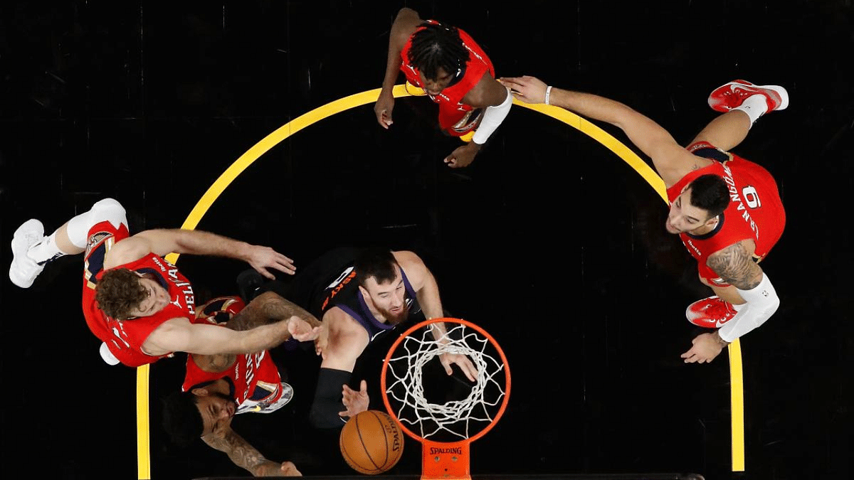 Frank Kaminsky #8 of the Phoenix Suns puts up a shot over Nicolo Melli #20 and Nickeil Alexander-Walker #6 of the New Orleans Pelicans during the second half of the NBA game at Phoenix Suns Arena. Credit: AFP