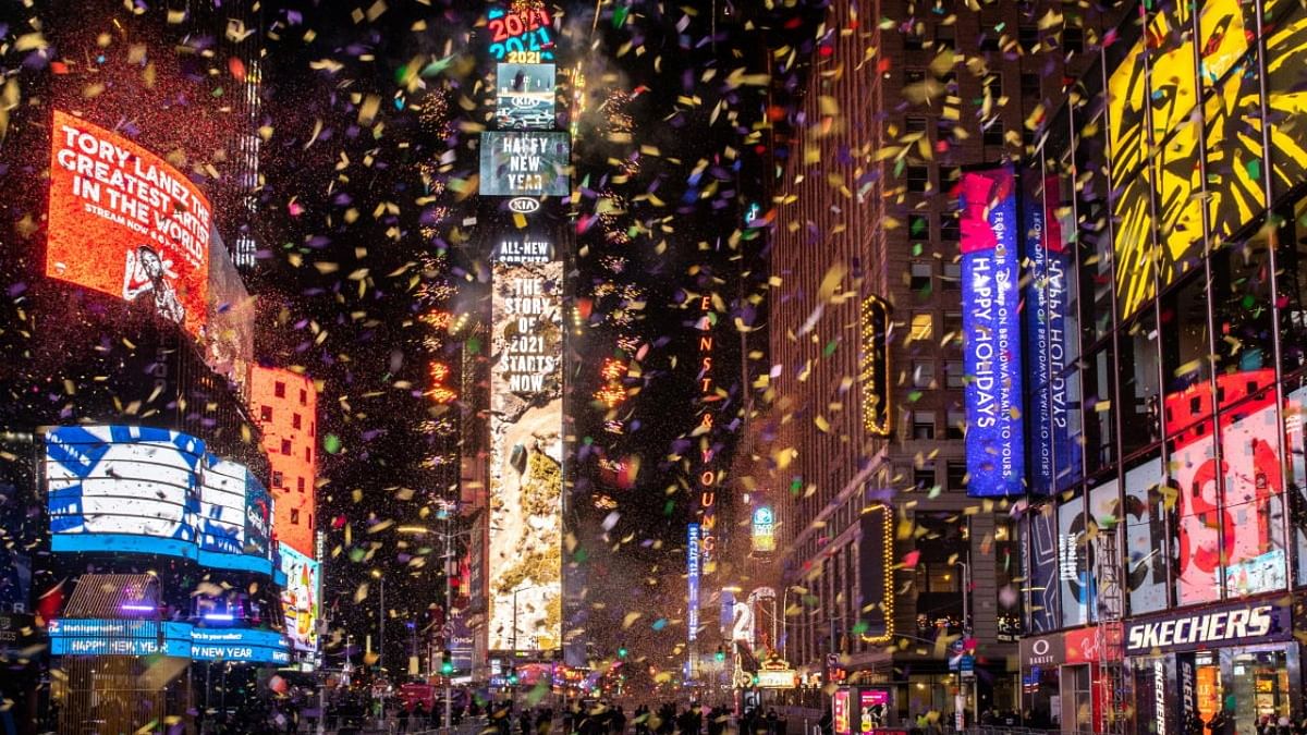 Confetti flies around the ball and countdown clock in Times Square during the virtual New Year's Eve event following the outbreak of Covid-19 in the Manhattan borough of New York City. Credit: Reuters