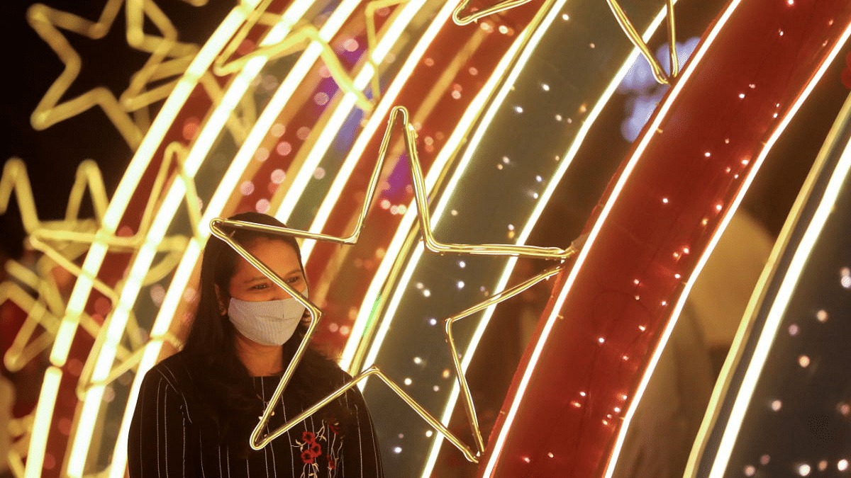 A woman poses for a picture at an installation on New Year's Eve inside a mall, amid the coronavirus disease (COVID-19) outbreak in Mumbai, India. Credit: Reuters