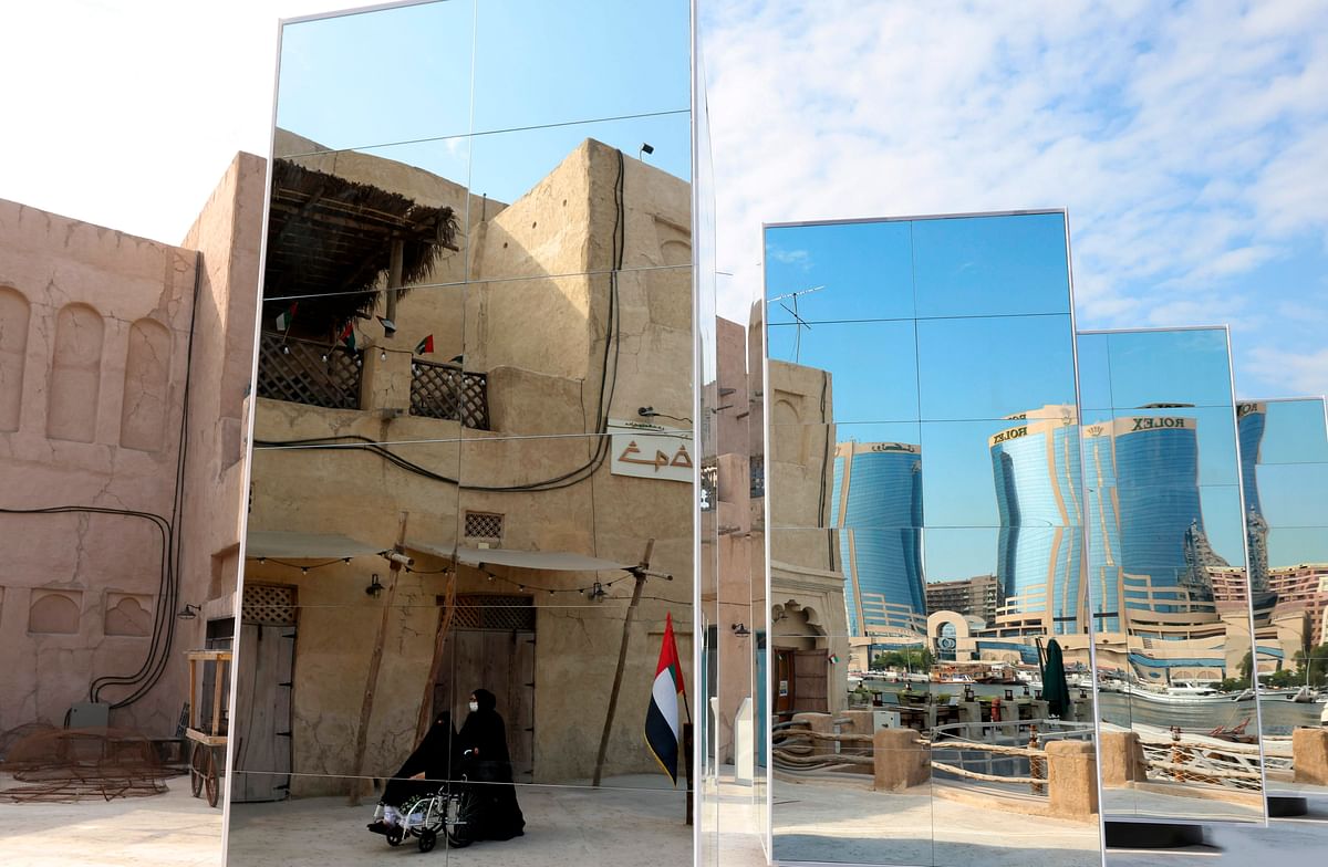 Dubai's old neighborhood of Deira with traditional architecture reflected on a mirror placed on the banks of the creek to highlight modern architectural development integrated with old heritage in the Gulf emirate. Credit: AFP Photo