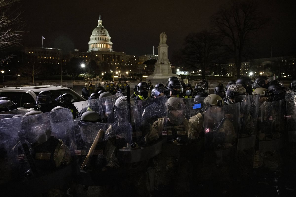 Members of the National Guard and the Washington DC police stand guard to keep demonstrators away from the US Capitol. Credit: AFP Photo