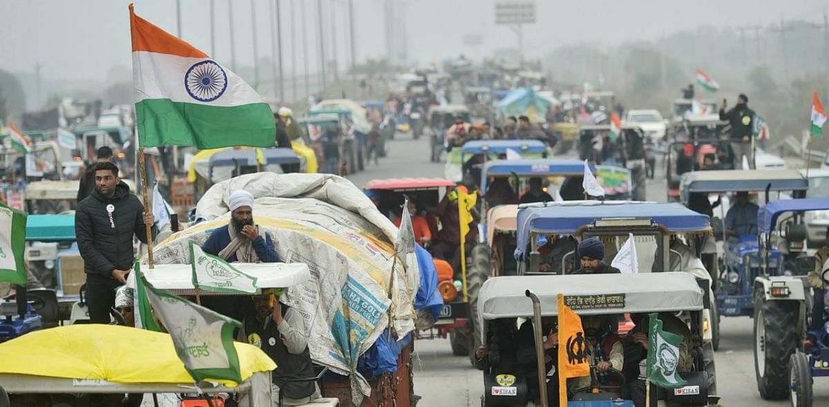 Farmers on their way to Tikri border during a tractor rally as part of their ongoing protest against the new farm laws, at Western Peripheral Expressway in Kundli, Sonipat, Thursday, Jan. 07, 2021. Credit: PTI Photo