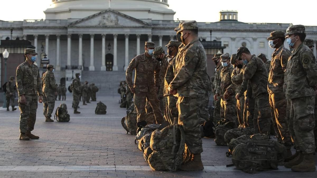 Members of the US National Guard arrive at the US Capitol on January 12, 2021 in Washington, DC. The Pentagon is deploying as many as 15,000 National Guard troops to protect President-elect Joe Biden's inauguration on January 20, amid fears of new violence. Credit: Tasos Katopodis/Getty Images/AFP.