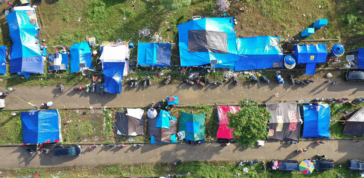 An aerial picture shows a temporary shelter for people affected by the quake following a 6.2 magnitude earthquake in Mamuju, 18 January 2021. Credit: AFP Photo