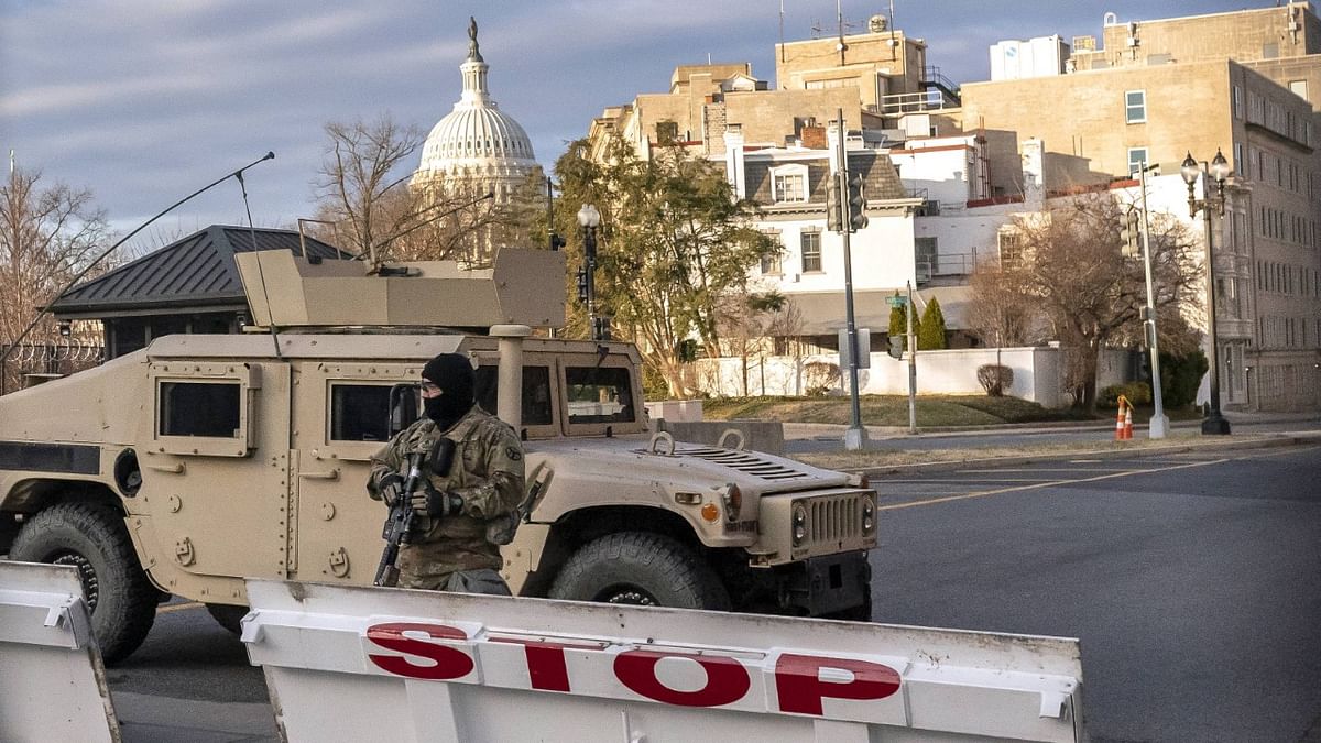Tanks and concrete barriers block the streets. Fencing lines the perimeter of the US Capitol complex. Checkpoints sit at intersections. Credit: AFP Photo