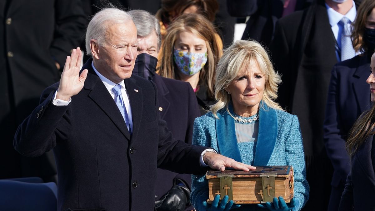 Joe Biden is sworn in as the 46th President of the United States as his wife Jill Biden holds a bible on the West Front of the US Capitol in Washington, US. Credit: Reuters Photo