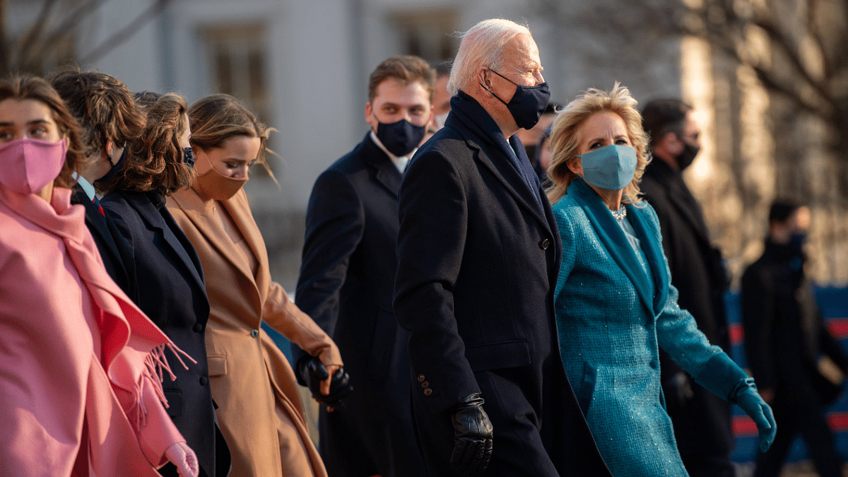 President Joe Biden, First Lady Dr. Jill Biden and family walk the abbreviated parade route after Biden's inauguration in Washington, DC. Credit: AFP Photo
