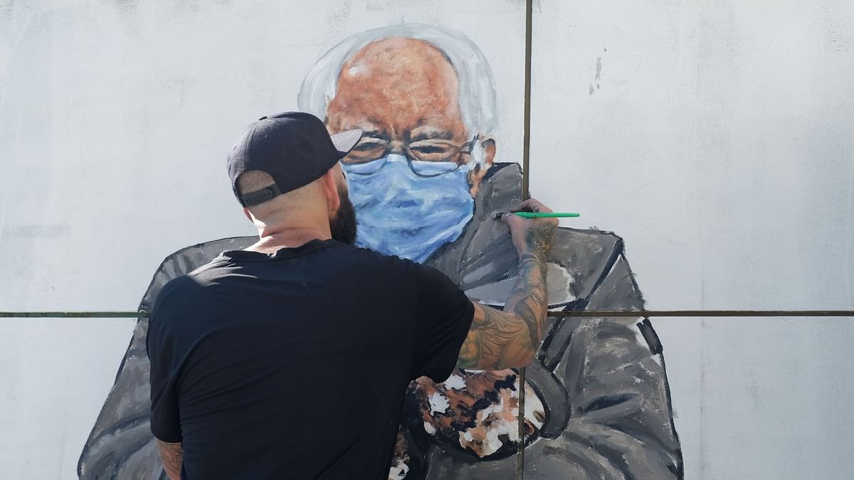 Artist Jonas Never (@never1959) paints a mural of Senator Bernie Sanders in Culver City, California. Credit: AFP Photo.