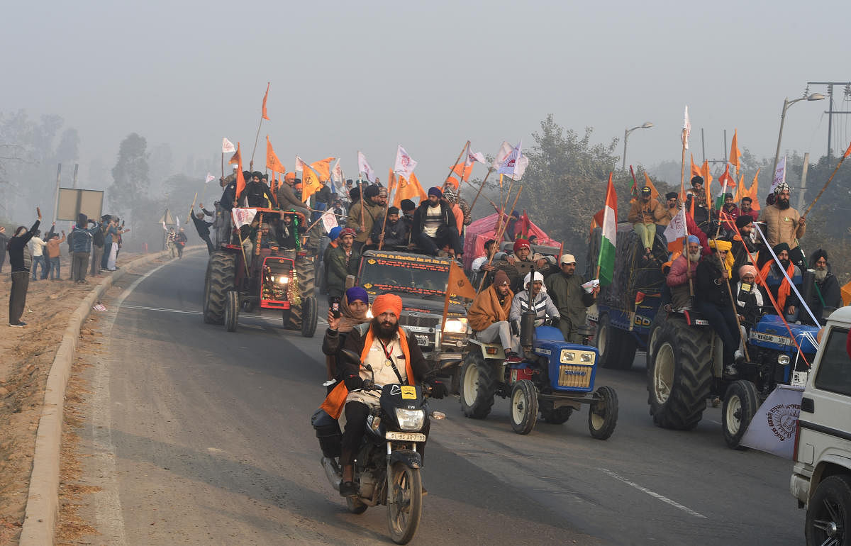 Thousands more, steering tractors bearing the flags of India and farm unions, had streamed in from neighbouring states for several days ahead of the rally. Credit: PTI Photo