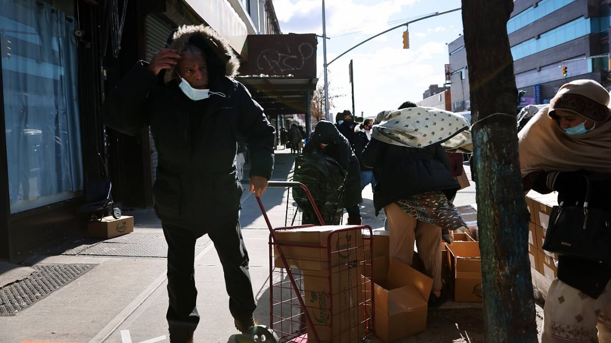 People receive food outside of a Brooklyn mosque and cultural centre. Credit: AFP Photo.