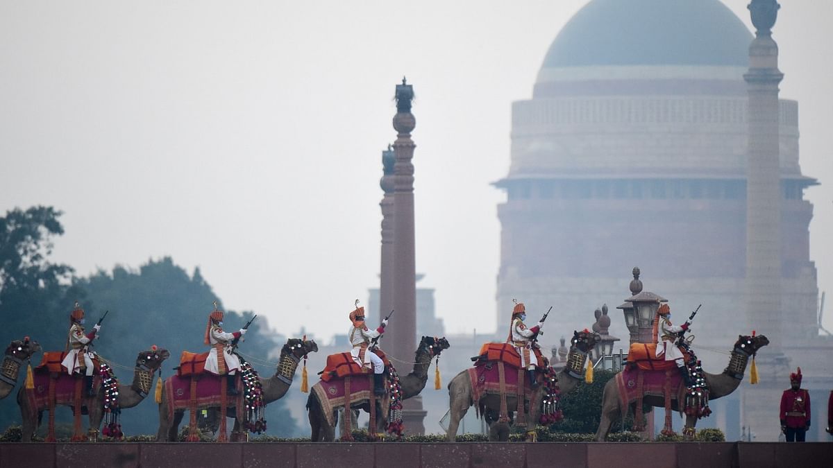 Border Security Force (BSF) camel mounted contingent stands guard at Raisina Hills during the Beating Retreat ceremony, in New Delhi. Credit: PTI Photo.