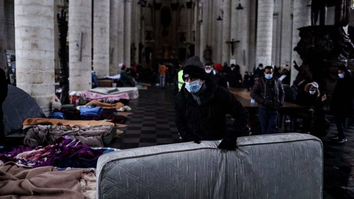 Migrants set up shelters as they occupy Saint-Jean-Baptiste-au-Beguinage church in Brussels. Credit: AFP Photo