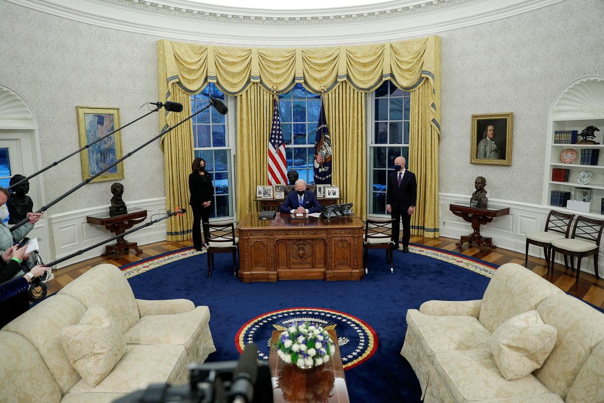 U.S. President Joe Biden prepares to sign executive orders on immigration at the White House in Washington, U.S., February 2, 2021. Credit: REUTERS