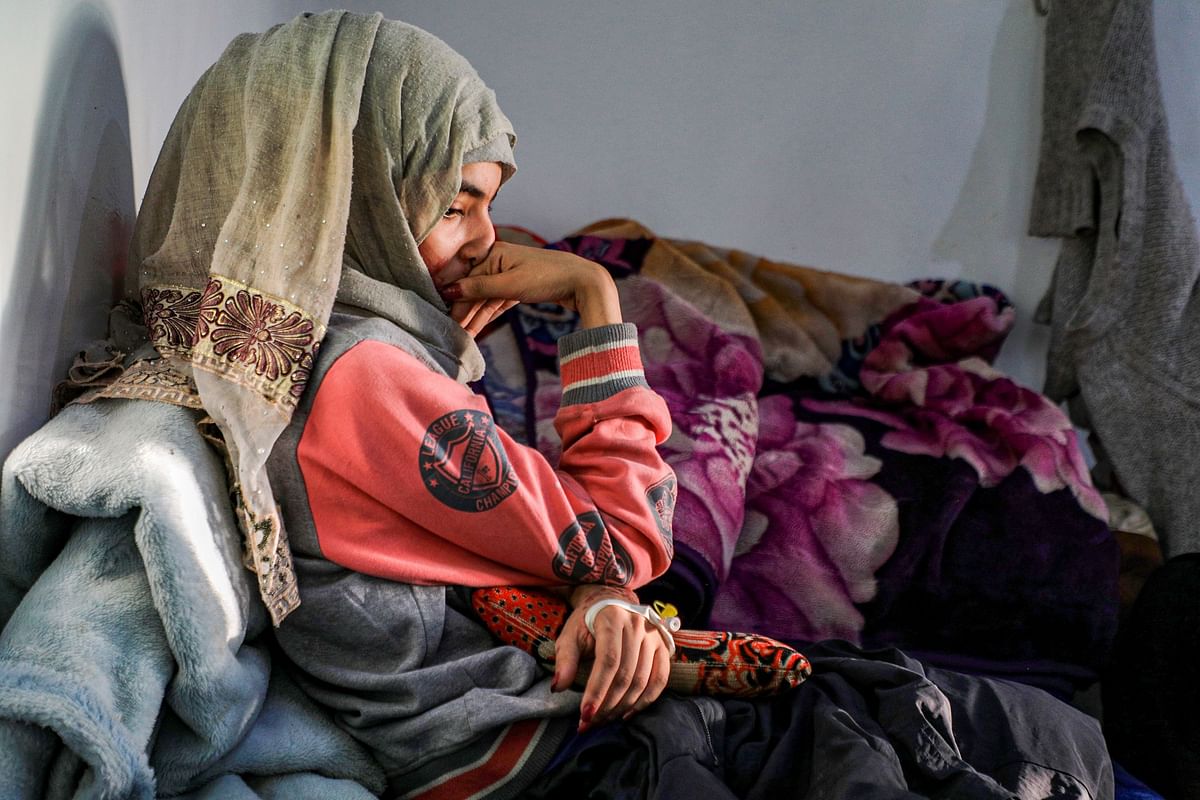 Anoud Hussain Sheryan, a 19-year-old girl disfigured in an acid attack by her abusive husband, sits at a hospital where she is undergoing treatment in Yemen's capital Sanaa on January 28, 2021. - Married at the age of 12, rejected at 16, and then disfigured in an acid attack, Sheryan's fate is a shocking illustration of abuse in a society beset by war and poverty. Now aged 19, the young Yemeni woman agreed to relate her ordeal at the hands of her abusive husband -- rare testimony in a country where domestic violence is largely hidden. Credit: AFP Photo