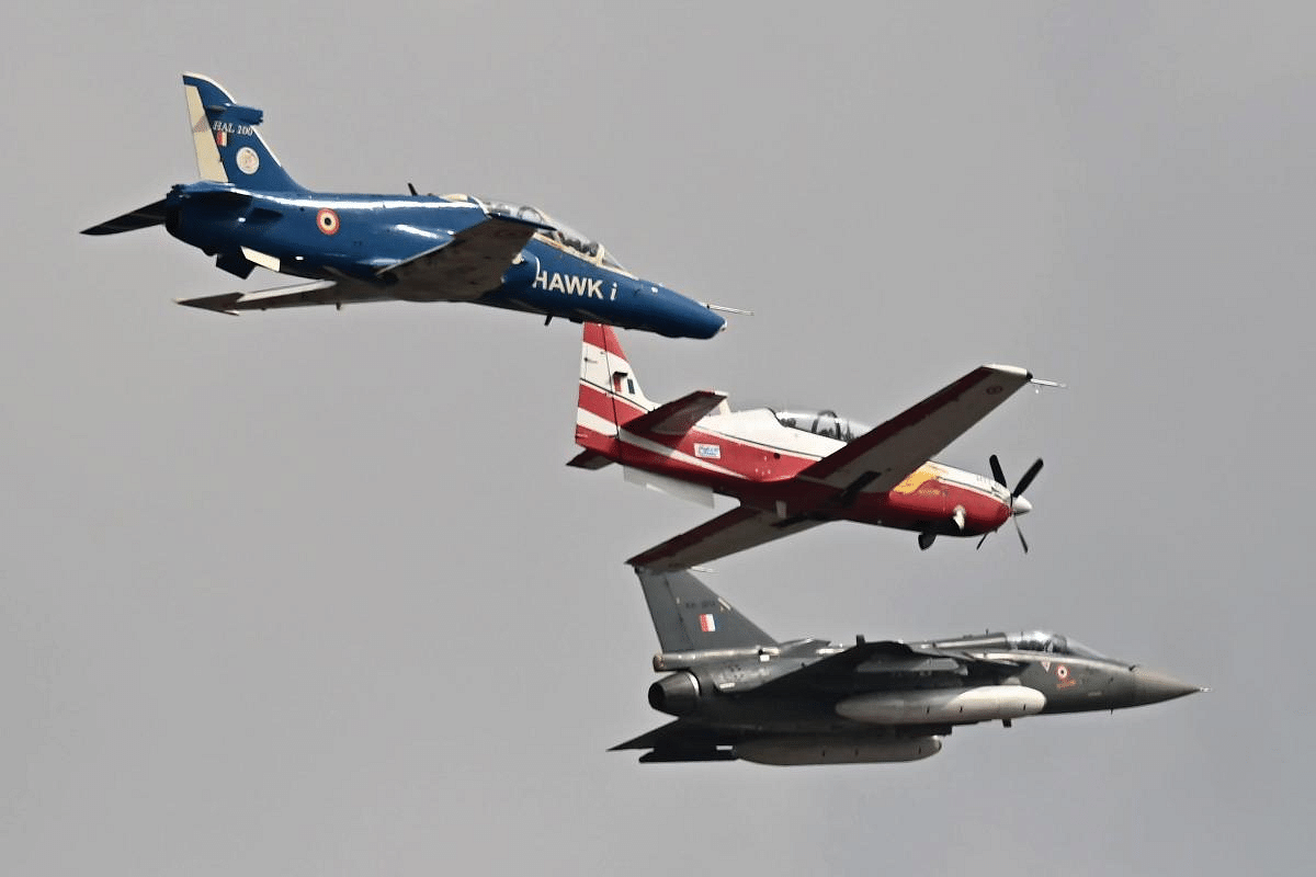 Indian Air Force (IAF) aircrafts fly past during the first day of the Aero India 2021 Airshow at the Yelahanka Air Force Station in Bengaluru. Credit: AFP Photo