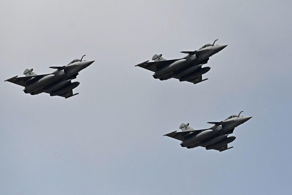 Indian Air Force's Rafale fighter jets fly past during the first day of the Aero India 2021 Airshow at the Yelahanka Air Force Station in Bengaluru. Credit: AFP Photo