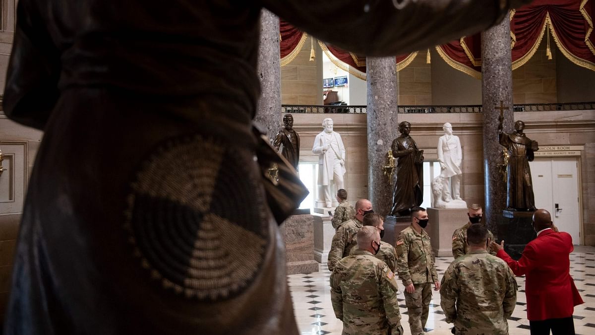 Members of the National Guard tour Statuary Hall on Capitol Hill in Washington, DC. Credit: AFP Photo