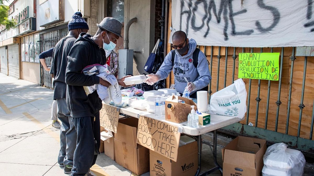 Members of the Los Angeles Tenants Union protest against evictions and give out food for the homeless in Hollywood, California. Credit: AFP Photo.