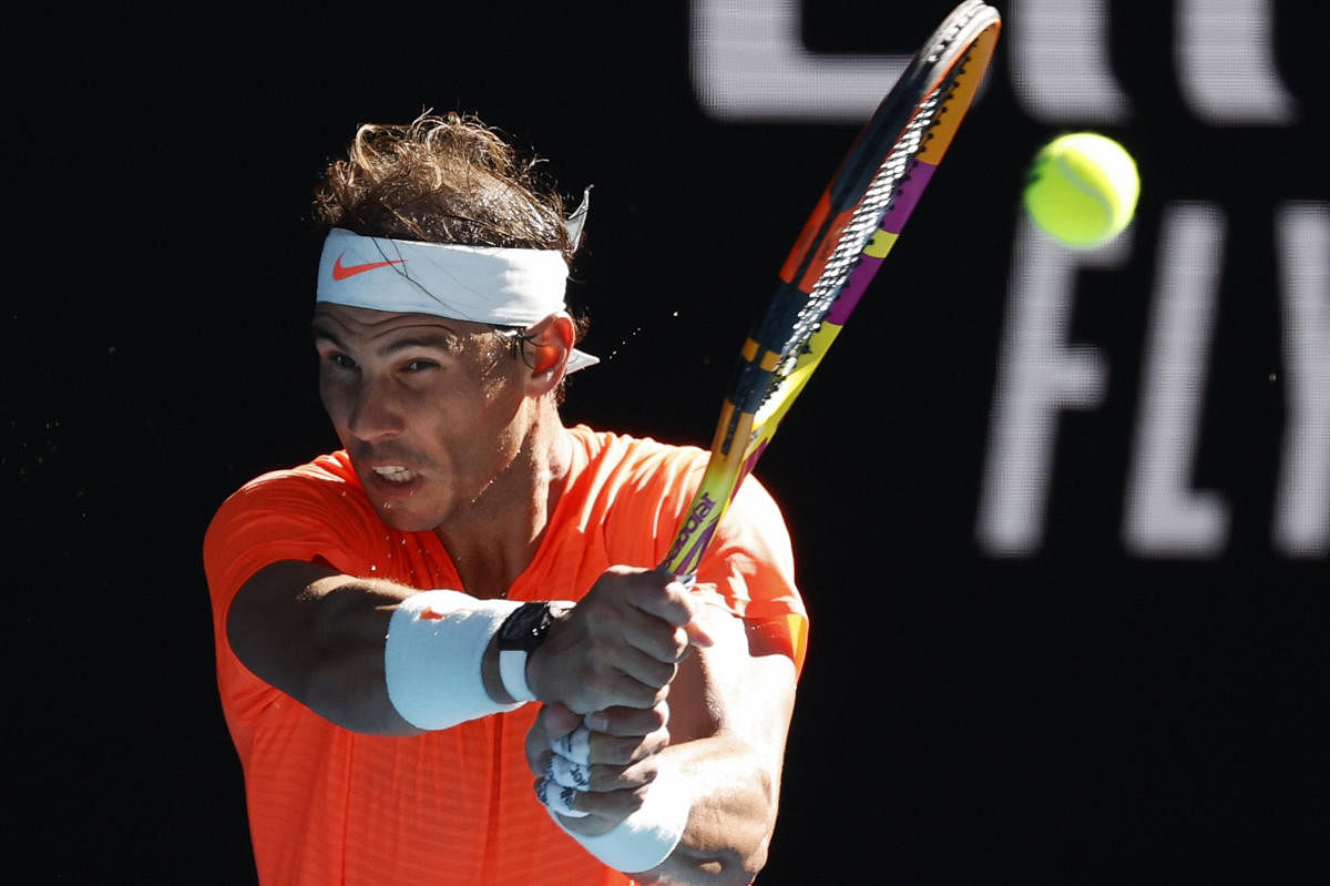 Spain's Rafael Nadal makes a backhand return to Serbia's Laslo Djere during their first round match at the Australian Open tennis championship in Melbourne, Australia. Credit: AP/PTI photo.