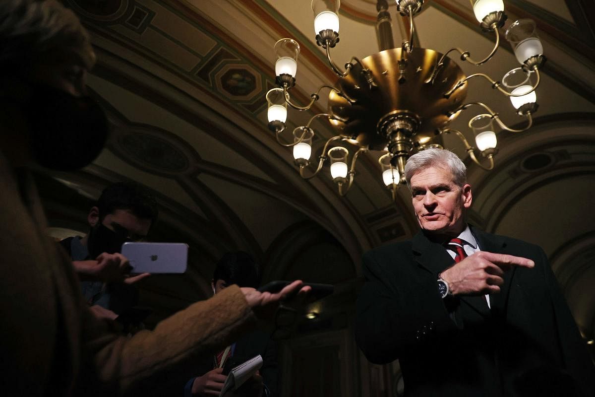 US Senator Bill Cassidy (R-LA) talks with reporters as he leaves the Capitol after the first day of former US President Donald Trump's second impeachment trial in Washington, DC. Credit: AFP photo.