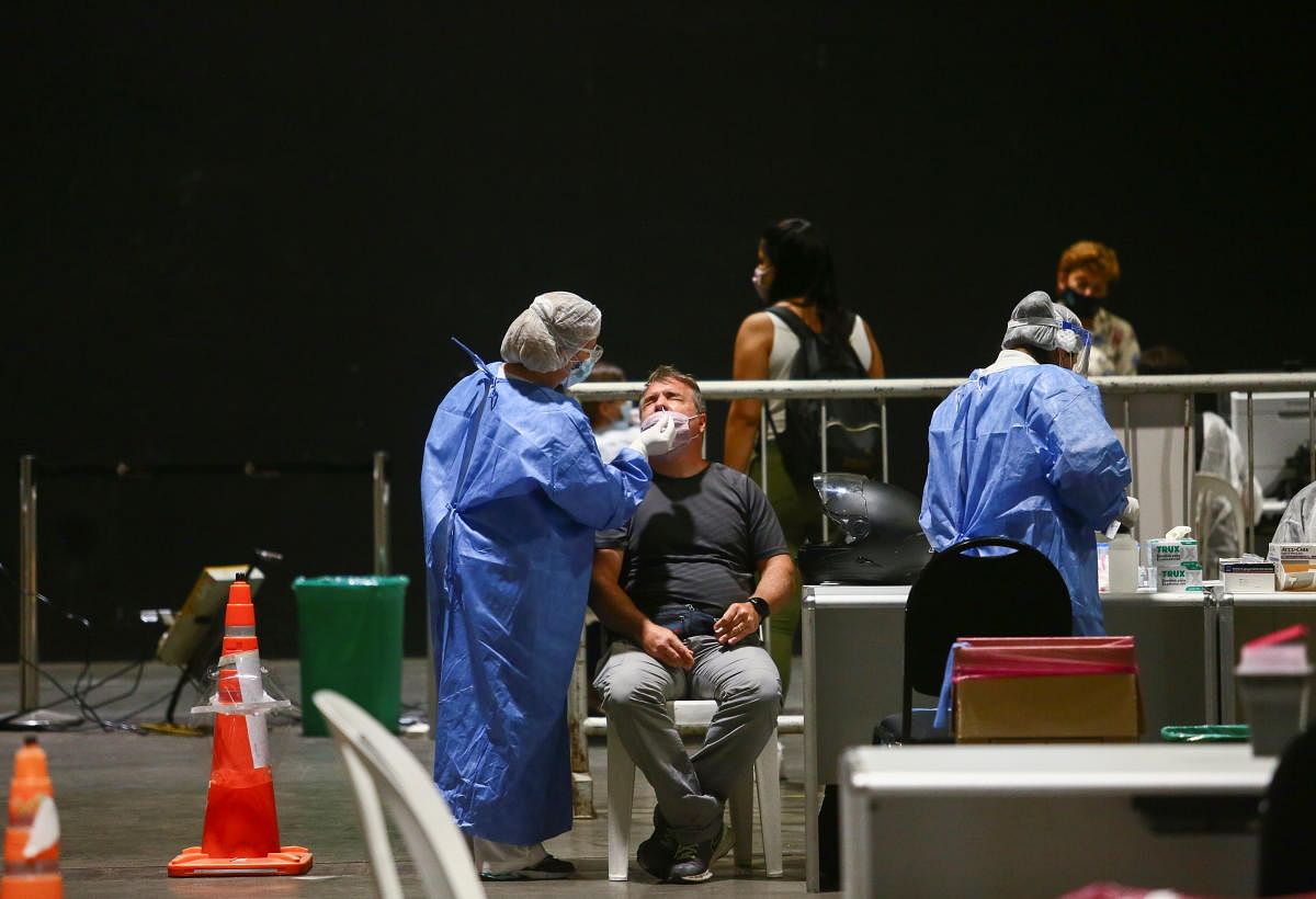Healthcare workers test teachers and school workers for the coronavirus disease (COVID-19) at the exposition centre La Rural before the reopening of schools, in Buenos Aires, Argentina. Credit: Reuters photo.