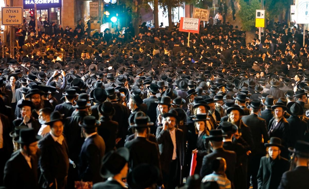 Ultra Orthodox Jews gather to protest against restrictions imposed by the Israeli government to curb cases of Covid-19, in Jerusalem's religious neighbourhood of Mea Shearim. Credit: AFP photo.