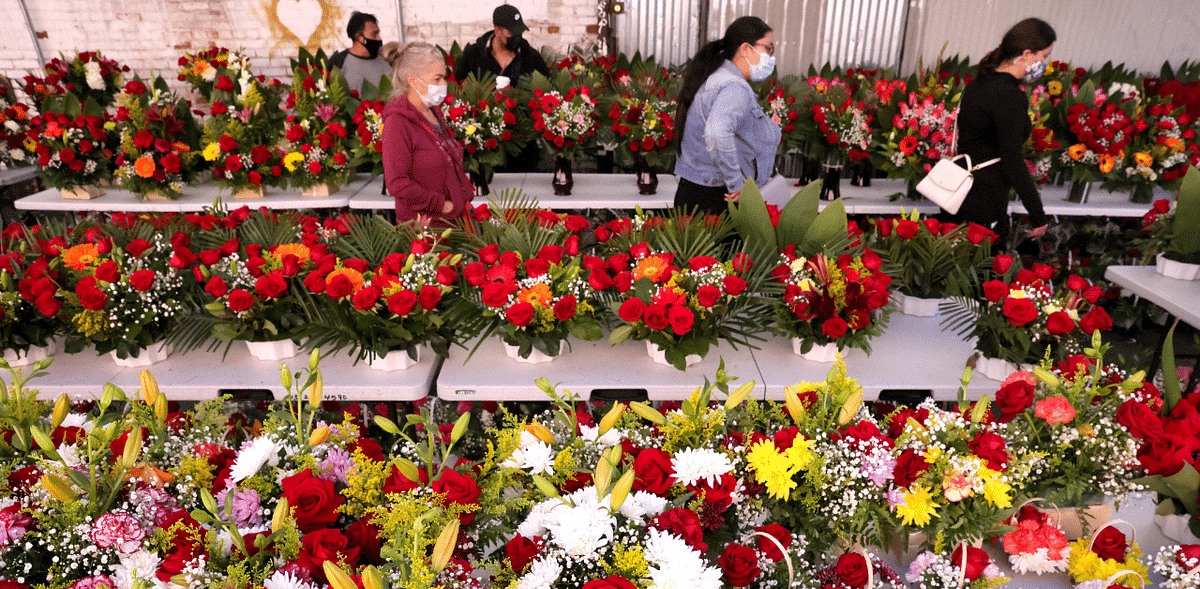 People browse for flowers in the flower district two days before Valentine's Day amid the Covid-19 pandemic in Los Angeles, California. Credit: AFP Photo