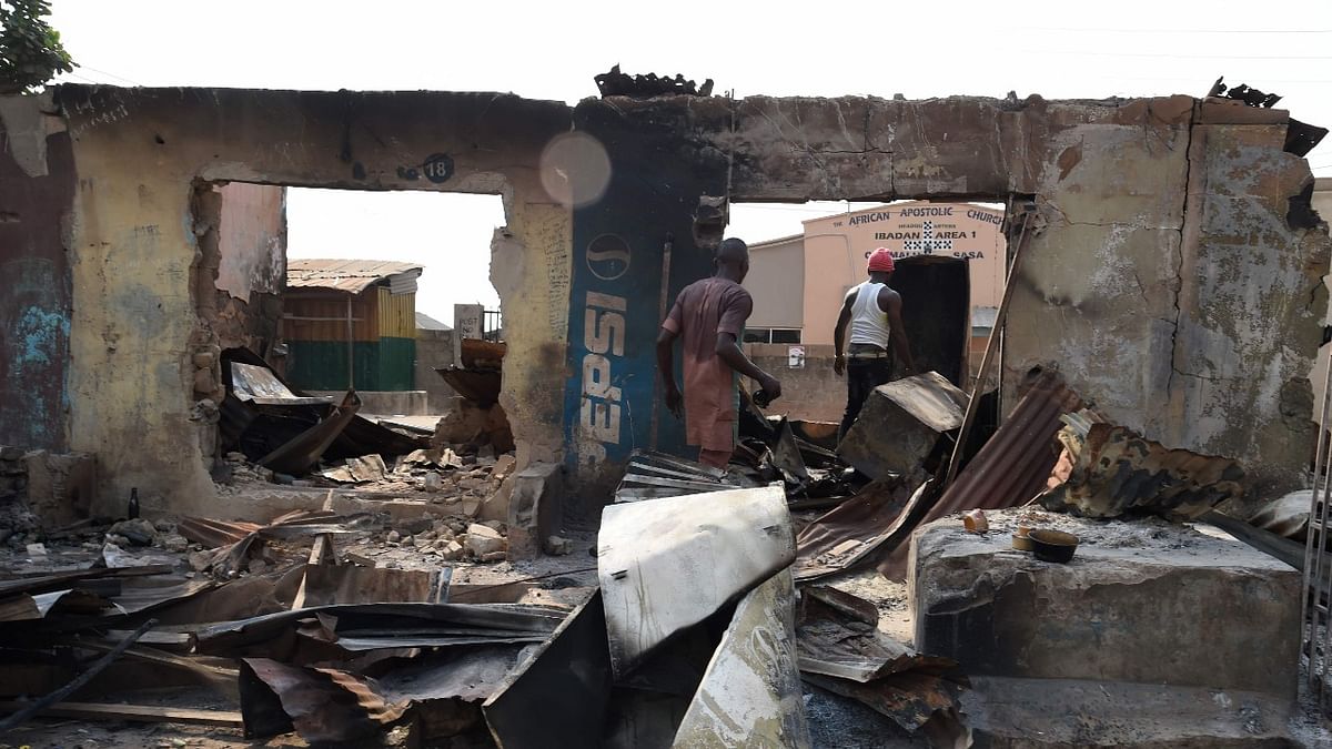 People try to salvaged valuables from burnt shop after deadly ethnic clashes between the northern Fulani and southern Yoruba traders at Shasha Market in Ibadan, southwest Nigeria. Credit: AFP Photo
