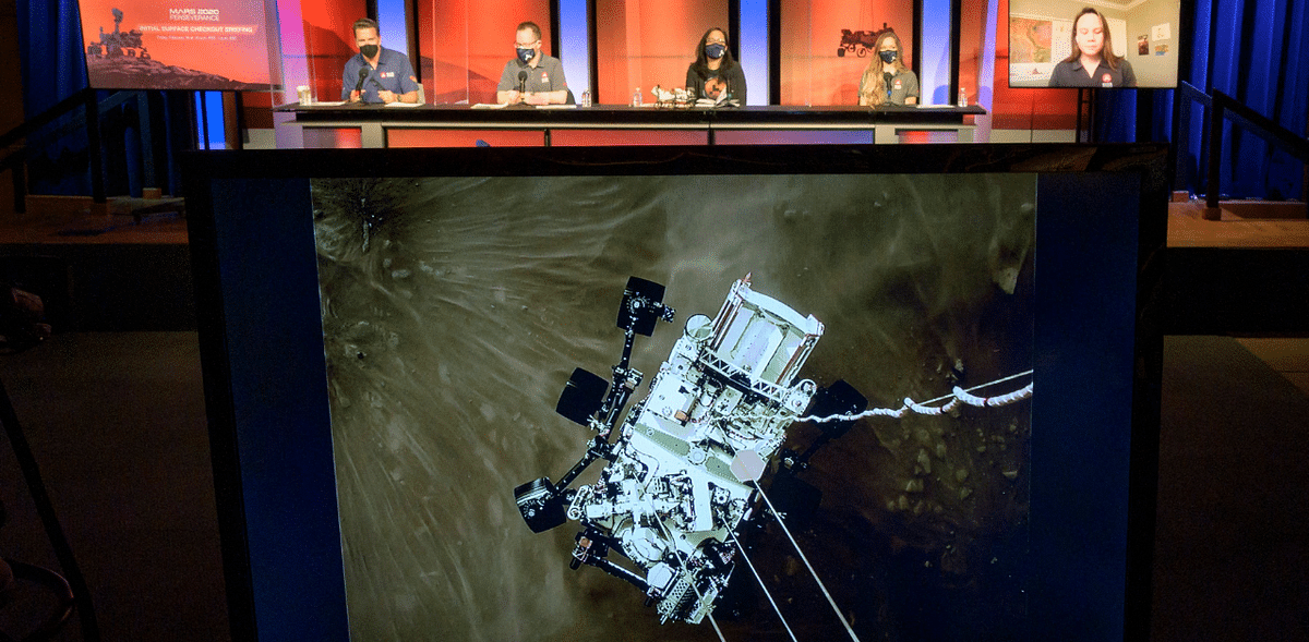 A high-resolution still image captured from cameras aboard the descent stage as NASA’s Perseverance rover touched down on Mars as it is displayed during a NASA Perseverance rover initial surface checkout briefing. Credit: AFP Photo