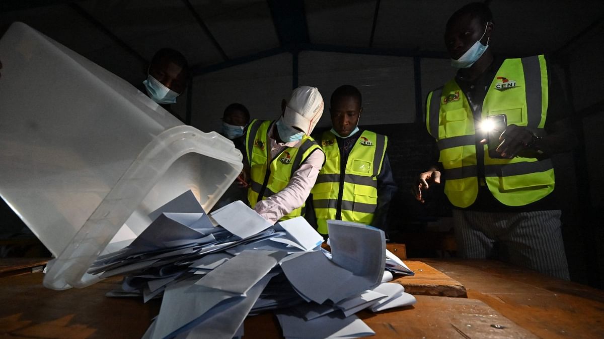 Niger's Electoral Commission workers count the ballots at a polling station during Niger's presidential election run-off in Niamey. Credit: AFP Photo