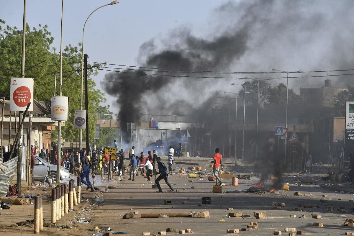 Police clash with Niger's opposition supporters protesting in the streets of Niamey on Febuary 23, 2021 after the announcement of the country's presidential run-off results. Credit: AFP Photo.