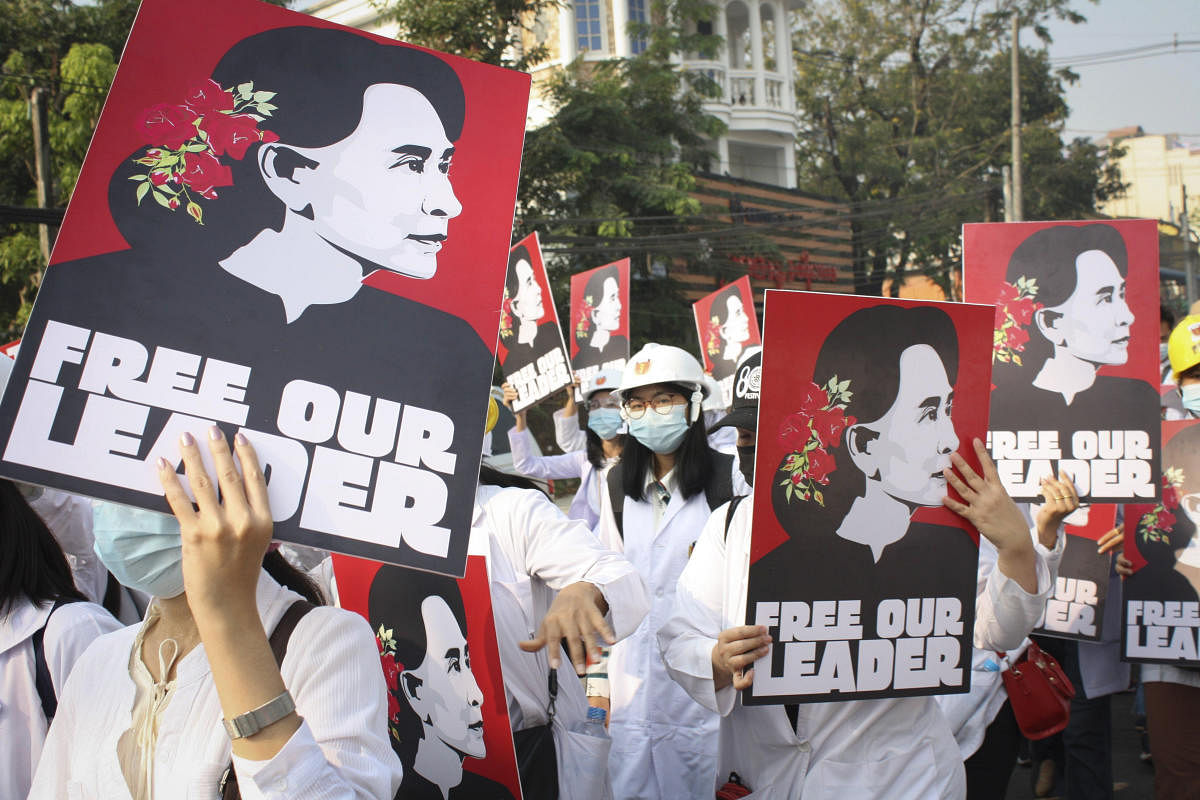 Medicals students display images of deposed Myanmar leader Aung San Suu Kyi during a street march in Yangon. Credit: AP Photo