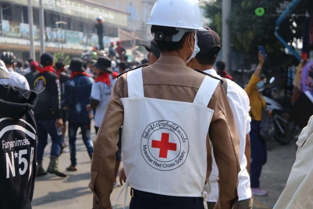 A member of Red Cross walks amid protests against the military coup in Dawei, Myanmar February 28, 2021 in this picture obtained from social media. Credit: Reuters