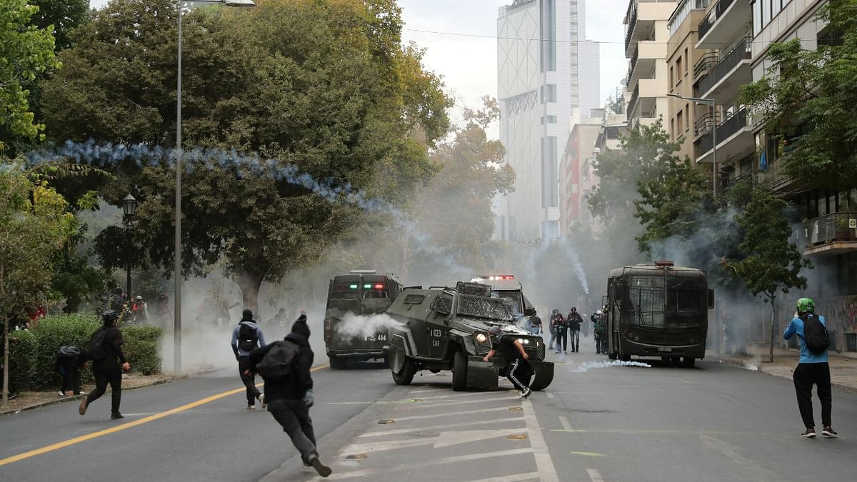 Demonstrators clash with riot police during a protest against Chile's government and the reopening of schools in Santiago, Chile. Credit: Reuters Photo