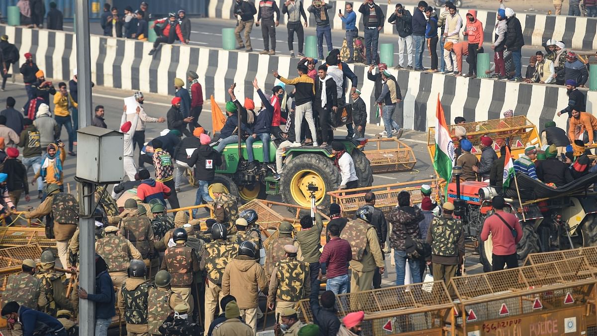 January 26 | The carefully planned tractor rally, which was coinciding with the Republic Day parade took an ugly turn as tractors broke the barricades and entered Delhi | Credit: PTI Photo