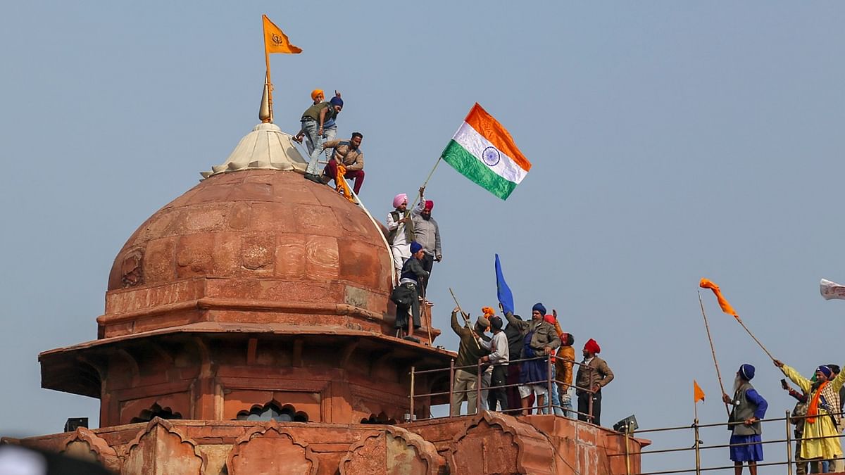 January 26 | The farmers that made it past security forces made assembled at Red Fort, where a small section of the protestors climbed the Red Fort ramparts and placed a 'Nihang' flag | Credit: PTI File Photo